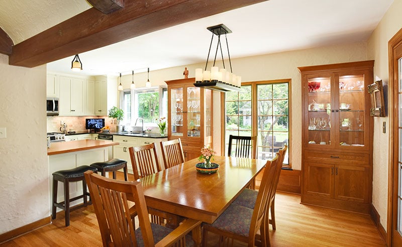 Kitchen remodel fort wayne looking over dining room table into kitchen with built ins
