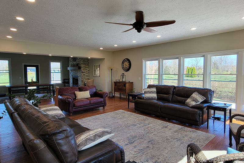 Room Additions featuring a bright living space with a wall of windows